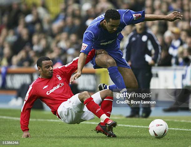 Matthieu Louis-Jean of Nottingham Forest tackles Paul Ifill of Millwall during the Coca-Cola Championship League match between Millwall and...