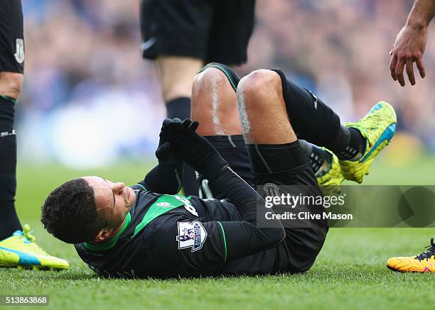 Ibrahim Afellay of Stoke City lies injured during the Barclays Premier League match between Chelsea and Stoke City at Stamford Bridge on March 5,...