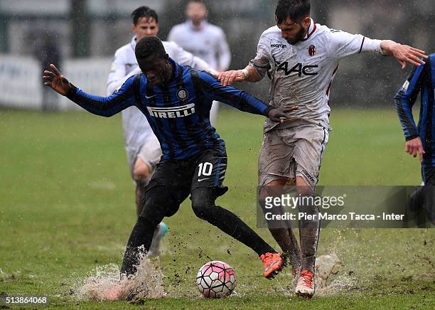 Jose Correia of FC Internazionale competes for the ball with Salvatore Tazza of Bologna FCduring the juvenile match between FC Internazionale and...