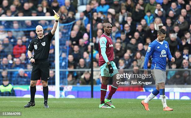 Kevin Mirallas of Everton is shown a red card by referee Anthony Taylor during the Barclays Premier League match between Everton and West Ham United...