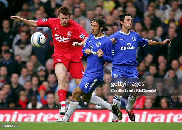 John Arne Riise of Liverpool battles with Ricardo Carvalho and Paulo Ferreira of Chelsea during the Barclays Premiership match between Chelsea and...