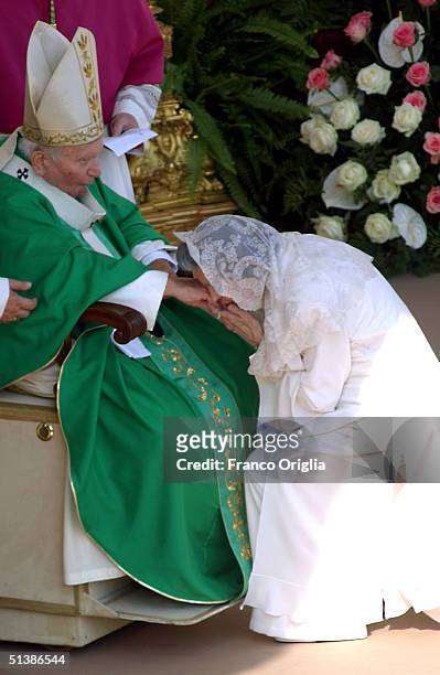 Queen Fabiola of Belgium kisses the hand of Pope John Paul II during a beatification ceremony held in St. Peter's Square for October 3 , 2004 in...