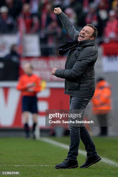 Head coach Andre Breitenreiter of Schalke celebrates his team's third goal between the Bundesliga match between 1. FC Koeln and FC Schalke 04 at...