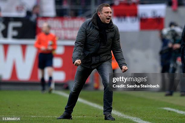 Head coach Andre Breitenreiter of Schalke celebrates his team's third goal between the Bundesliga match between 1. FC Koeln and FC Schalke 04 at...