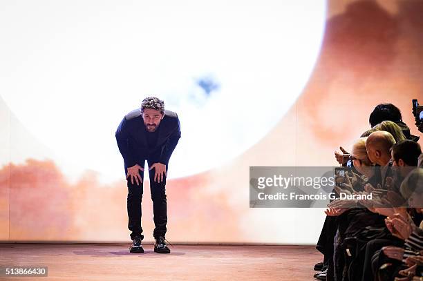 Fashion designer David Koma acknowledges the audience at the end of the Mugler show as part of the Paris Fashion Week Womenswear Fall/Winter...