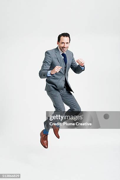 portrait of man - man jumping stock pictures, royalty-free photos & images