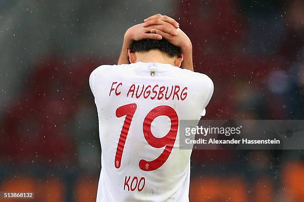 Ja-Cheol Koo of Augsburg reacts after the Bundesliga match between FC Augsburg and Bayer Leverkusen at WWK Arena on March 5, 2016 in Augsburg,...