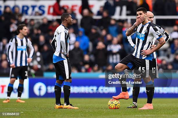 Georginio Wijnaldum , Aleksandar Mitrovic and Jonjo Shelvey of Newcastle United react after Bournemouth's second goal during the Barclays Premier...