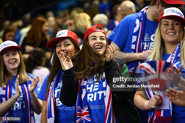 Great Britain fans celebrate after their team takes a 2-1 lead following the doubles match between Andy Murray and Jamie Murray of Great Britain and...