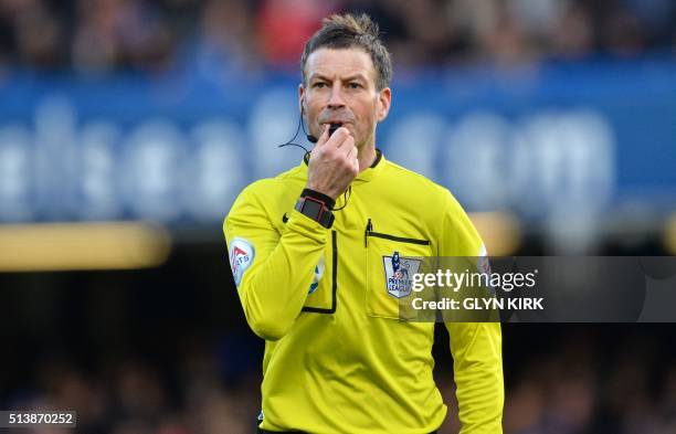 Referee Mark Clattenburg blows the whistle during the English Premier League football match between Chelsea and Stoke City at Stamford Bridge in...