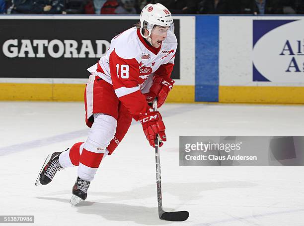 Blake Speers of the Sault Ste Marie Greyhounds skates with the puck against the London Knights during an OHL game at Budweiser Gardens on March 4,...
