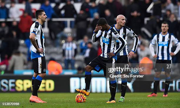 Newcastle player Georginio Wijnaldum reacts as the players wait to restart after the third goal during the Barclays Premier League match between...