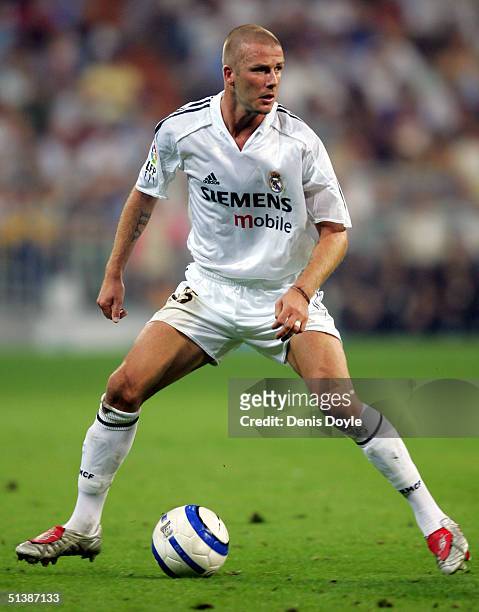 Real Madrid?s David Beckham works out his next move during the Primera Liga match against Deportivo La Coruna at The Bernabeu on October 3, 2004 in...