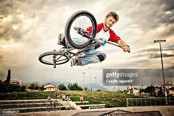 bmx rider - bicycle stunt stock pictures, royalty-free photos & images