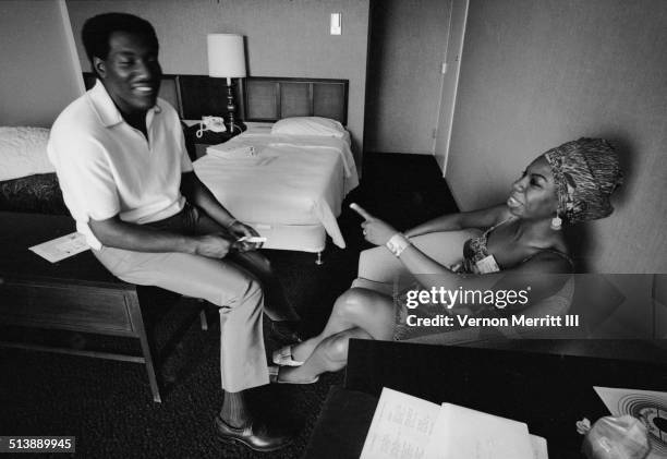 During the NARA convention, musicians Otis Redding and Nina Simone share a laugh in a room at the Regency Hyatt Hotel, Atlanta, Georgia, August 9...