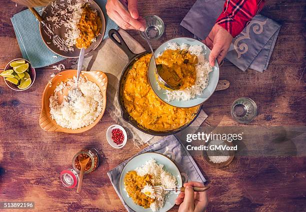 eating delicous homemade chicken curry dish with rice - serving size stock pictures, royalty-free photos & images