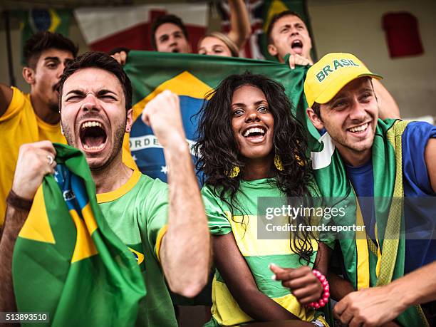 brazilian supporters cheering at stadium - brazil football bildbanksfoton och bilder