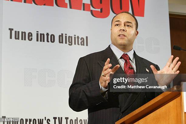 Chairman Michael Powell gestures as he speaks at a press conference at FCC headquarters October 4, 2004 in Washington, DC. Powell unveiled a new...