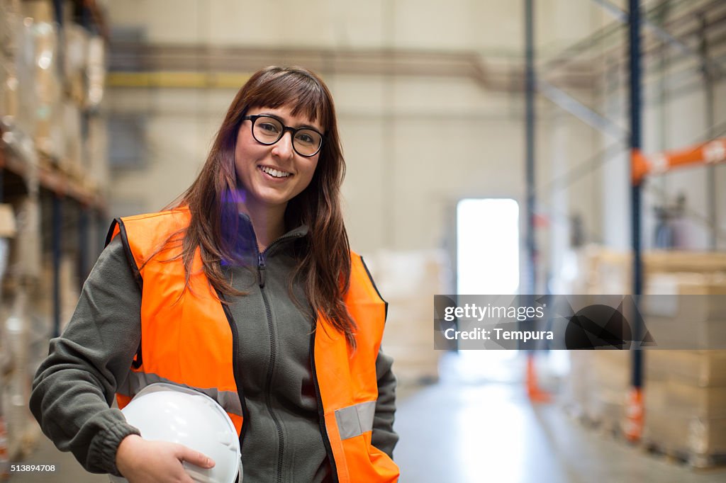 Female manual worker portrait smiling at camera.