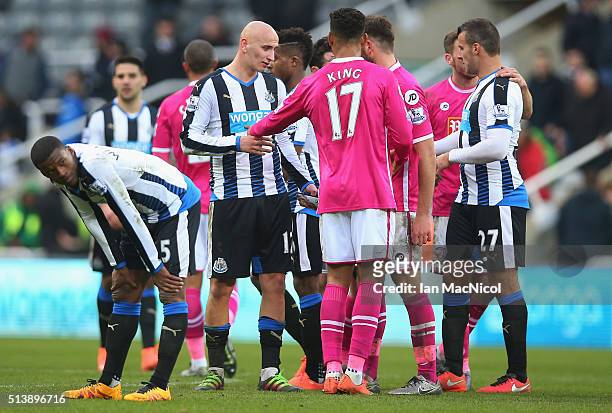 Playes shake hands after the Barclays Premier League match between Newcastle United and A.F.C. Bournemouth at St James' Park on March 5, 2016 in...