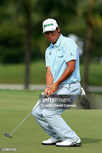 Hideki Matsuyama of Japan reacts to his putt on the fifth hole during the third round of the World Golf Championships-Cadillac Championship at Trump...