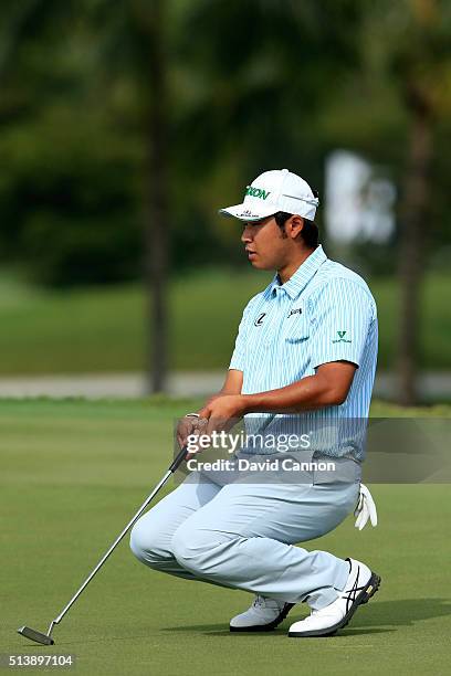 Hideki Matsuyama of Japan reacts to his putt on the fifth hole during the third round of the World Golf Championships-Cadillac Championship at Trump...