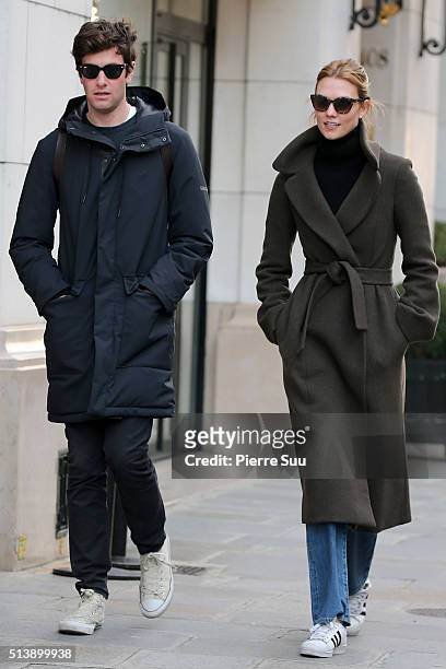 Karlie Kloss and boyfriend Joshua Kushner walk in the street of Paris on March 5, 2016 in Paris, France.