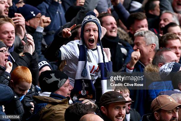 Young Tottenham Hotspur supporter reacts after Harry Kane of Tottenham Hotspur scores his team's second goal during the Barclays Premier League match...