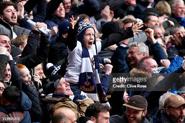 Young Tottenham Hotspur supporter reacts after Harry Kane of Tottenham Hotspur scores his team's second goal during the Barclays Premier League match...