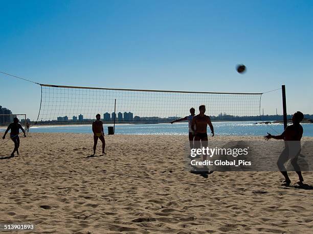 beach-volleyball - young men in speedos stock-fotos und bilder