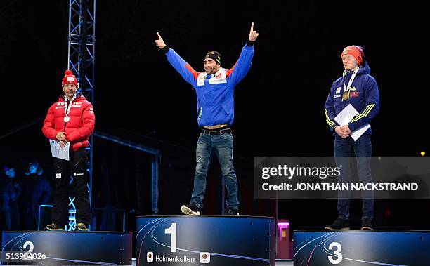 Second placed Ole Einar Bjorndalen of Norway, winner Martin Fourcade of France, third placed Ukraine's Sergey Semenov pose during a medal ceremony...