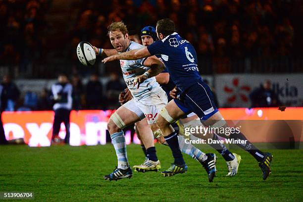 Antoine Claassen of Racing 92 holds off Remi Vaquin of Agen during the French Top 14 rugby union match between Racing 92 v Agen at Stade Yves Du...