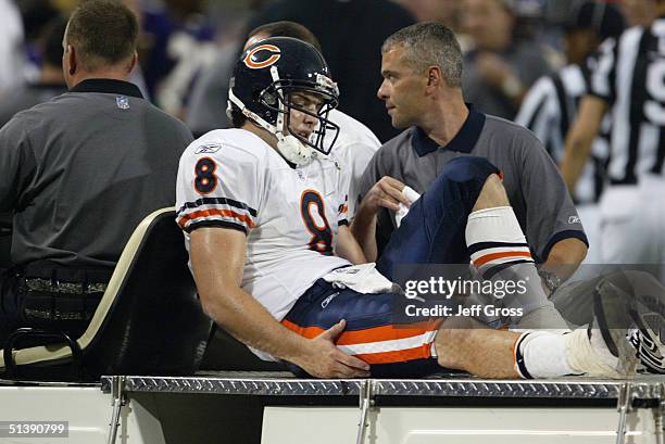 Quarterback Rex Grossman of the Chicago Bears is carted off the field injured during a game against the Minnesota Vikings at the Hubert H. Humphrey...