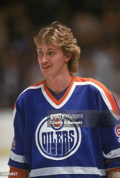 Wayne Gretzky of the Edmonton Oilers looks on as he skates on the ice during a game in 1982. Wayne Gretzky played for the Edmonton Oilers from 1979