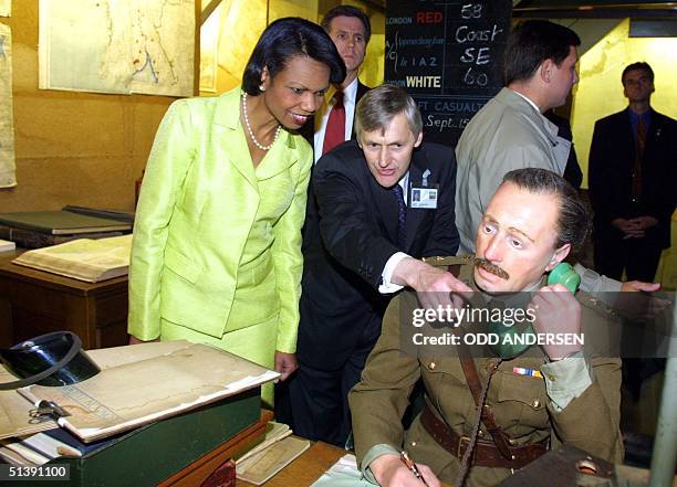 White House National Security Advisor Condoleezza Rice is guided through the map room of Winston Churchill's Cabinet War Rooms in London, 19 July...