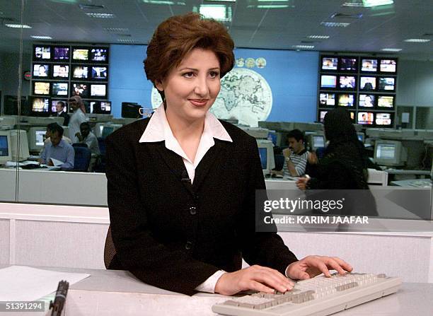 Muntaha al-Rumahi, television announcer and presenter for the Qatari-based Al-Jazeera television channel, seen in the Doha studios 13 October 2001....