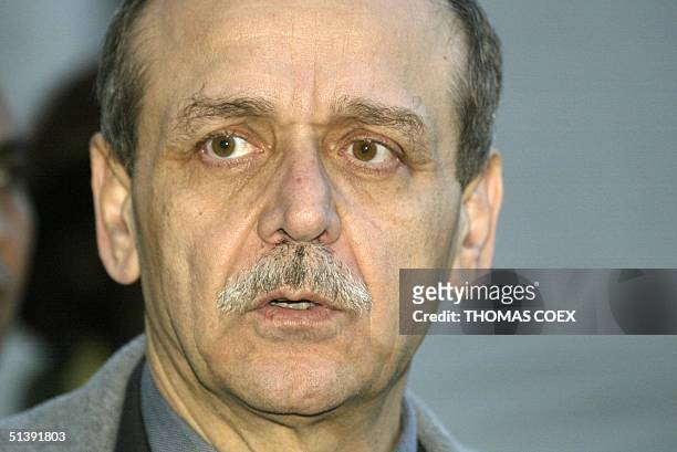 Palestinian Authority Information Minister Yasser Abd Rabbo poses in Ramallah 06 December 2001, before a meeting between Palestinian Authority...