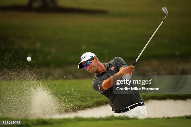 Adam Scott of Australia out of the bunker on the 17th hole during the third round of the World Golf Championships-Cadillac Championship at Trump...