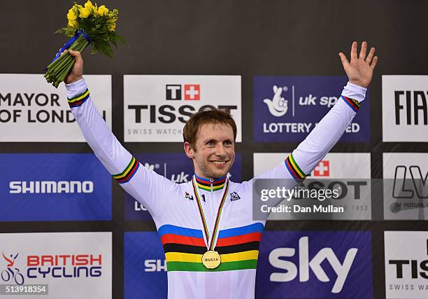 Jason Kenny of Great Britain celebrates on the medal podium after winning the Men's Sprint Final during Day Four of the UCI Track Cycling World...