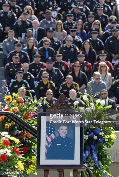 Officer David Hofer's portrait on stage at Pennington Field in Fort Worth, Texas, during a memorial service for the Euless, Texas, police officer on...