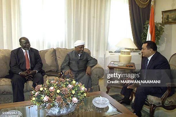 Egyptian President Hosni Mubarak meets at Borg al-Arab airport north of Cairo 20 June 2001, with Sudanese Mohammed Osman al-Mirghani , head of the...