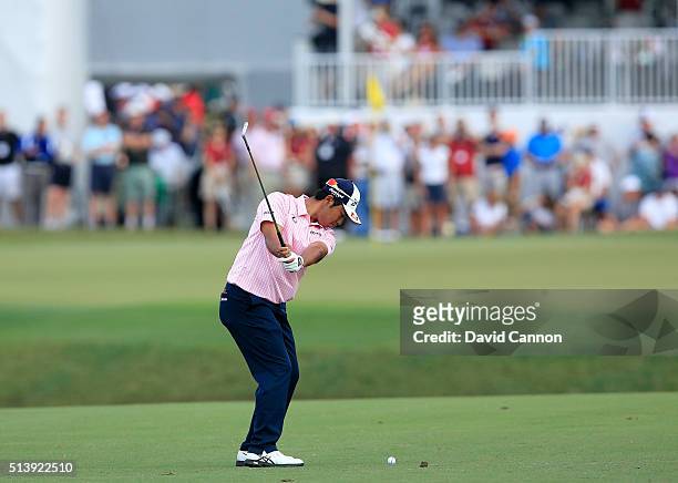 Hideki Matsuyama of Japan plays a short iron during the second round of the 2016 World Golf Championship Cadillac Championship on the Blue Monster...