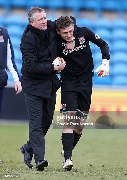 Northampton Town manager Chris Wilder celebrates victory with Adam Smith at the end of the Sky Bet League Two match between Carlisle United and...