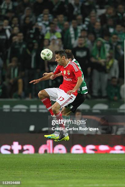 Benfica's forward Jonas vies with Sporting's defender Joao Pereira during the match between Sporting CP and SL Benfica for the Portuguese Primeira...