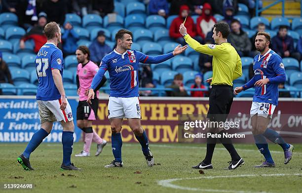 David Atkinson of Carlisle United is shown a yellow card by referee David Coote during the Sky Bet League Two match between Carlisle United and...