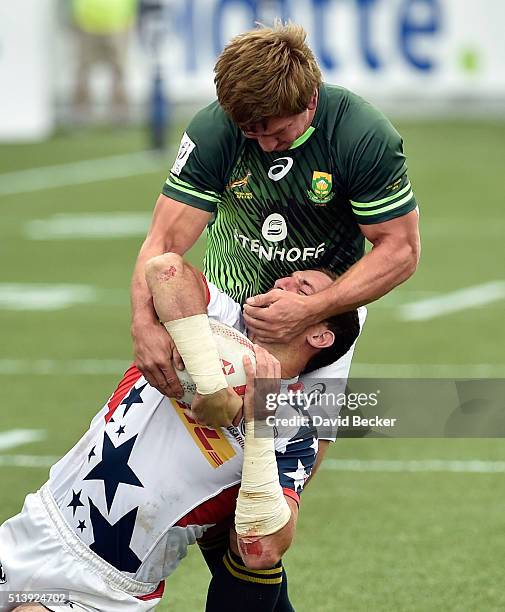 Kwagga Smith of South Africa grabs for the ball against Zack Test of the United States during the USA Sevens Rugby tournament at Sam Boyd Stadium on...