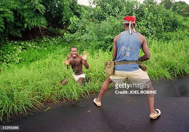 Rebel of Charles Taylor's National Patriotic Front of Liberia fire 03 August 1990 in Bentol on student William Weah , executing him after roadside...