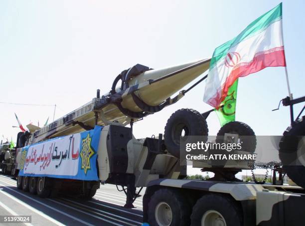 Shahab 3 missiles are driven past Iranian President Mohammad Khatami at the mausoleum of Iran's late leader Ayatollah Ruhollah Khomeini, on Army Day...