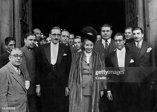 Picture taken in the 1940s in Buenos Aires of Eva Peron leaving the Parliament. The man on her right is Ricardo Guardo, the speaker of the...