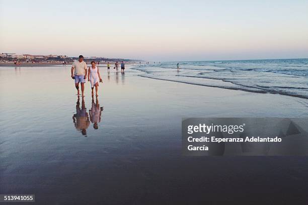 People on the beach in Cadiz, Spain August 24, 2014